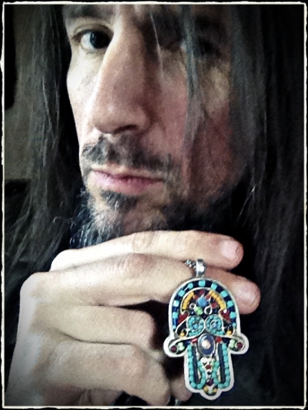 Bumblefoot's Hamsa -- The longer I live the more I accept that anything is possible.  Can I truly attribute some good fortune to an amulet?  I don't know.  If I don't know, I have to be open to the possibility.  The power of *belief* is something real.  It's a beautiful gift from a friend, and the kindness of this gift on its own is strength for the soul." (Photo courtesy of Ron Thal)